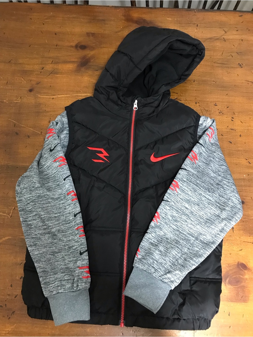 Nike Black Hooded Puffer Jacket with Gray Sleeves and Red Accents